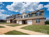 Newly built townhomes with garages and well-manicured lawn at 5149 Tommy Ln # 1102, Stanley, NC 28164