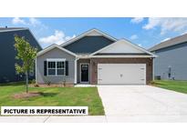 Charming single-Gathering home with a mix of brick and siding, complemented by a well-manicured front lawn at 105 Way Cross Ln, Troutman, NC 28166