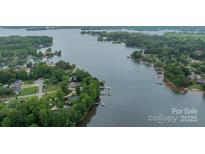 Stunning aerial view of a waterfront community with lush greenery and serene lake views at 134 Lawrence Tee Ln, Mooresville, NC 28117
