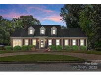 Charming brick home with black shutters, manicured landscaping, and a welcoming front entrance at 222 E Carter St, Lincolnton, NC 28092
