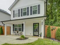 Inviting front porch with stylish seating and classic architectural details at 1209 Gaston Ave, Gastonia, NC 28052