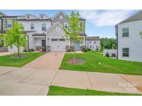 Charming townhome with a one-car garage, well-maintained lawn and landscaping in a desirable neighborhood at 12110 Chesapeake Mallard Dr, Charlotte, NC 28262