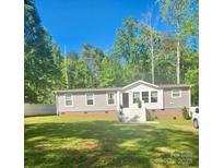 Charming home with well-manicured lawn and inviting front entrance at 2025 Kisatchie Dr, Hickory Grove, SC 29717