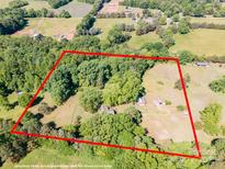 A beautiful aerial view showing the property's boundaries, lush trees, and charming homesites at 290 Glenmere Ln, Mooresville, NC 28115