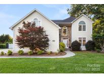 Charming home with stone accents, manicured lawn, and mature tree at 3340 Blue Jay Pass, Fort Mill, SC 29708