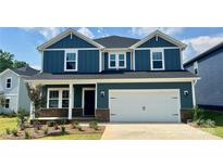 Beautiful, two-story home with a blue exterior, white trim, and a spacious two-car garage in a residential neighborhood at 110 Obadiah Ct, Mooresville, NC 28115