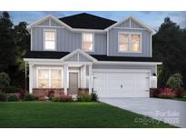 Charming two-story home with light grey siding, white trim, and a two-car garage at 1210 Morehead Dr, Salisbury, NC 28144