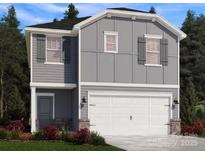Charming two-story home featuring a two-car garage, gray siding, and shuttered windows at 1425 Wildflower St, Newton, NC 28658