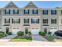 Charming townhomes showcasing a blend of neutral sidings, dark shutters, and well-manicured landscaping at 2715 Sydney Overlook Ln, Charlotte, NC 28269