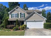 Charming two-story home featuring a well-manicured lawn, beautiful landscaping, and a two-car garage at 4698 Hannah Dr, Rock Hill, SC 29732