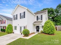 Charming two-story home features a well-manicured lawn, a light-colored driveway, and a welcoming front entrance at 908 Sundance Dr, Gastonia, NC 28054