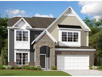 Charming two-story home featuring a stone archway, gray siding, and a two-car garage at 1303 Yellow Springs Dr, Huntersville, NC 28078