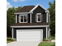 Charming two-story home featuring a two-car garage and stylish dark siding at 743 Lockhaven Nw Dr, Concord, NC 28027