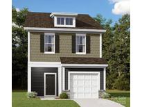 Charming two-story home featuring a traditional design and a well-manicured lawn at 746 Lockhaven Nw Dr, Concord, NC 28027