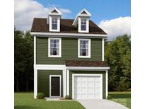 Charming two-story home with an attached garage, dormer windows, and an inviting front door, creating a welcoming curb appeal at 750 Lockhaven Nw Dr, Concord, NC 28027