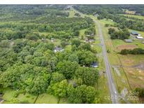 Lush greenery surrounds this neighborhood, captured in a stunning aerial view at 5240 Old Monroe Rd, Indian Trail, NC 28079