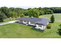 Charming single-story home with manicured lawn and inviting front porch at 5710 Lander Benton Rd, Unionville, NC 28110