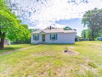 Charming single-story home with lush front lawn and mature trees at 1470 Hilltop St, Albemarle, NC 28001