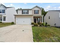 Charming two-story home featuring a two-car garage and well-manicured landscaping at 2922 Patishall Ln, Charlotte, NC 28214