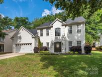 Charming two-story home with a well-maintained lawn and beautiful landscaping at 3626 Cole Mill Rd, Charlotte, NC 28270