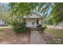 Charming one-story home with vinyl siding, front porch and well-maintained landscaping at 409 Rosemont Ave, Kannapolis, NC 28081