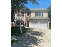 Charming two-story home with red shutters, stone accents, a two-car garage, and a well-manicured lawn at 10431 Plantain Ct, Charlotte, NC 28213