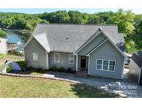 Charming single-Gathering home with well-maintained lawn and proximity to the lake at 126 Strand Rd, New London, NC 28127