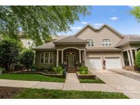 Charming home featuring a well-manicured lawn and a two-car garage at 18846 Cloverstone Cir, Cornelius, NC 28031