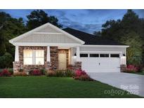Charming single-story home featuring stone accents, a covered porch, and an attached two-car garage at 437 Bent Burr Crk, York, SC 29745