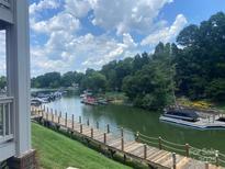 Picturesque waterfront view featuring a private boat dock with ample boat parking at 104 Pier 33 Dr # 311, Mooresville, NC 28117