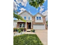 Charming brick and siding home with a manicured lawn and a two-car garage at 112 Paradise Hills Cir, Mooresville, NC 28115