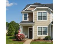 Charming two-story home featuring a welcoming front porch and well-manicured lawn at 1176 Constitution Park Blvd, Rock Hill, SC 29732