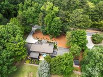 Stunning aerial view of a private home surrounded by lush, mature trees and manicured landscaping at 54 Honeysuckle Woods, Clover, SC 29710
