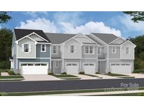 New construction townhomes with white trim, blue and gray siding, and two car garages in a contemporary style at 2027 Vinyasa Ln # Sts-40, Charlotte, NC 28215