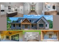 Beautiful home exterior featuring stone accents, wood columns, covered porch, and landscaped yard at 2313 Ivey Church Rd, Maiden, NC 28650