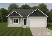 Charming single-story home with a neatly manicured lawn and attached garage at 2706 Lyla Ave, Concord, NC 28027
