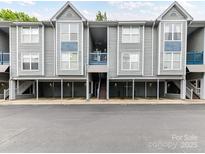 Charming condo building with well-maintained landscaping and convenient parking at 517 N Graham St # 3E, Charlotte, NC 28202