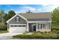 Charming one-story home with a two-car garage, well-manicured lawn, and classic architectural details at 527 Sunharvest Ln, Indian Trail, NC 28079