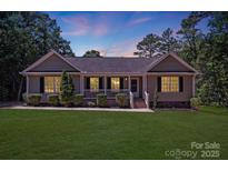 Charming single-story home featuring a well-manicured lawn and inviting front porch at 5564 N Hillsdale Dr, Fort Lawn, SC 29714