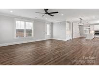 Spacious living room with luxury vinyl plank flooring, white walls, and large window at 1852 Yardley St, Rock Hill, SC 29732