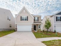 Charming two-story home with a two-car garage and a well-maintained lawn at 11019 Daisy Ct, Charlotte, NC 28262