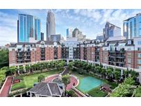 Beautiful courtyard view of a luxury building with lush landscaping and walkways in a vibrant urban setting at 300 W 5Th St # 644, Charlotte, NC 28202