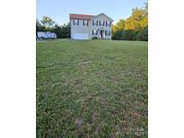 Two-story home featuring a well-manicured lawn and a two-car garage at 3401 Shillinglaw Rd, Sharon, SC 29742
