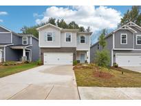 Charming two-story home with a two-car garage and light blue shutters and door at 1421 Wildflower St, Newton, NC 28658