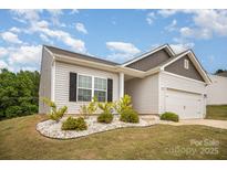 Charming one-story home with a well-manicured lawn and bright, natural sunlight at 2030 Lanza Dr, Charlotte, NC 28215
