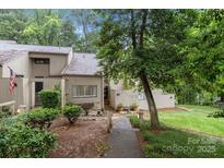 Charming townhome with mature trees and landscaping creates a serene setting and inviting curb appeal at 222 Riverview Ter, Clover, SC 29710