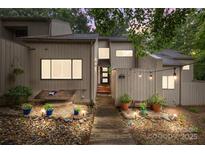 Charming home featuring a landscaped front entrance with a stone pathway and warm lighting at 222 Riverview Ter, Clover, SC 29710