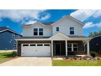 Charming two-story home with a brick and siding facade, a two-car garage, and a well-maintained front yard at 425 Bent Burr Crk, York, SC 29745
