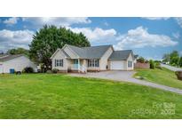 Charming single-Gathering home featuring a well-manicured lawn and inviting curb appeal at 5052 Swinging Bridge Rd, Conover, NC 28613