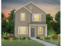 Charming two-story home featuring neutral siding, manicured landscaping, and a welcoming entrance at 14028 Parkside Crossing Dr # 331, Charlotte, NC 28273